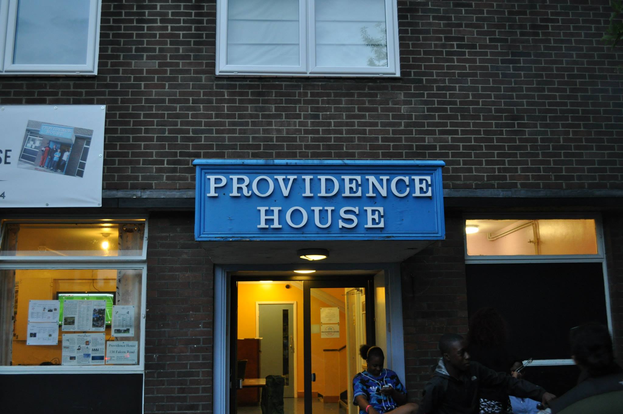 Young person with a lamb at Providence House